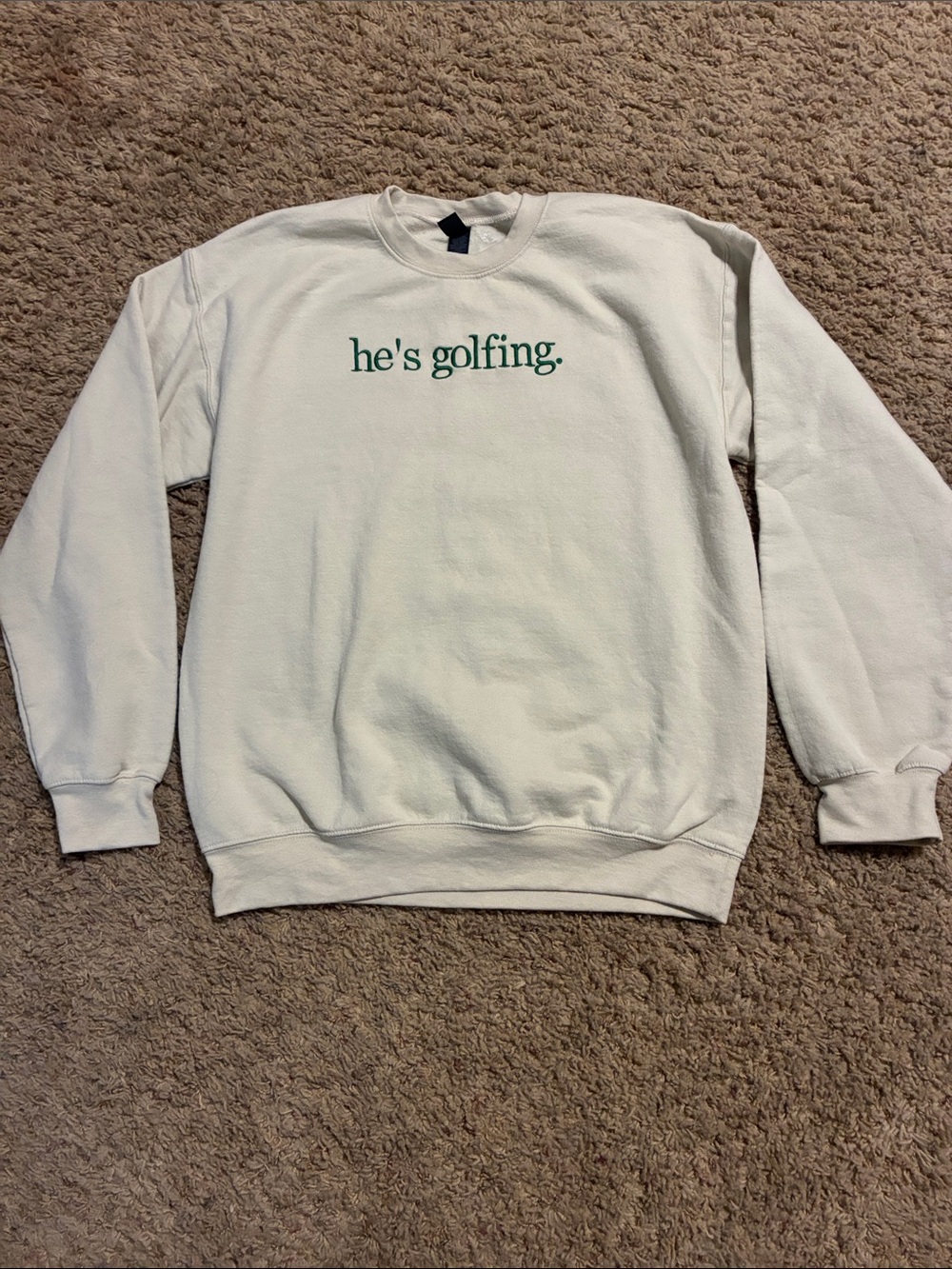 Gildan White Crewneck Sweatshirt with Green "he's golfing." Text